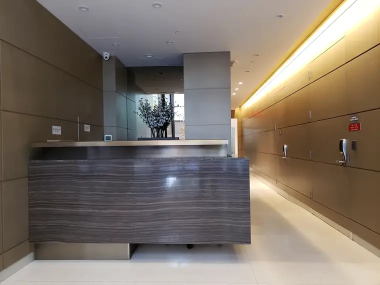 19 Park Place, Fabrication and installation of front desk, custom millwork by New Wings in New York